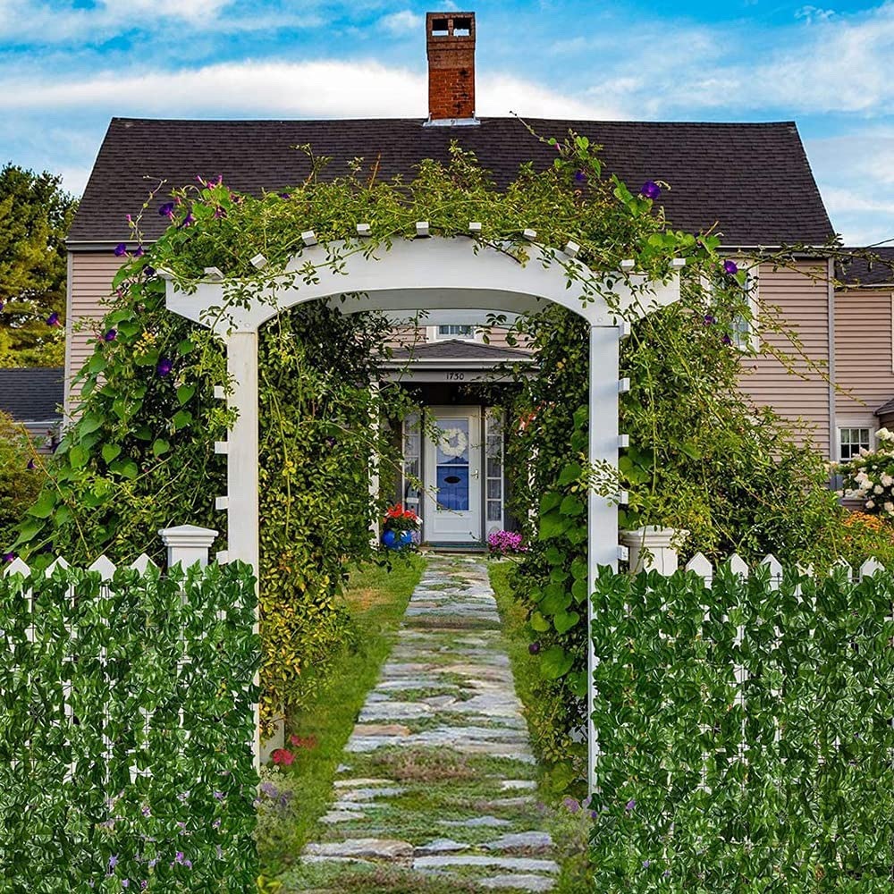 A garden archway attached to a house, representing home exterior space